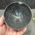 Cracked gray shell tea cup with tin-carved bronze patterns
