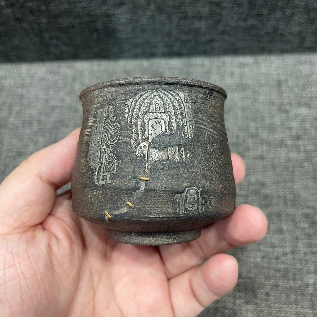 Jianzhan is naturally fired with ash, using a wood-fired kiln. Hand-carved tin sculptures of Buddha statues from Dunhuang