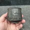 Jianzhan is naturally fired with ash, using a wood-fired kiln. Hand-carved tin sculptures of Buddha statues from Dunhuang