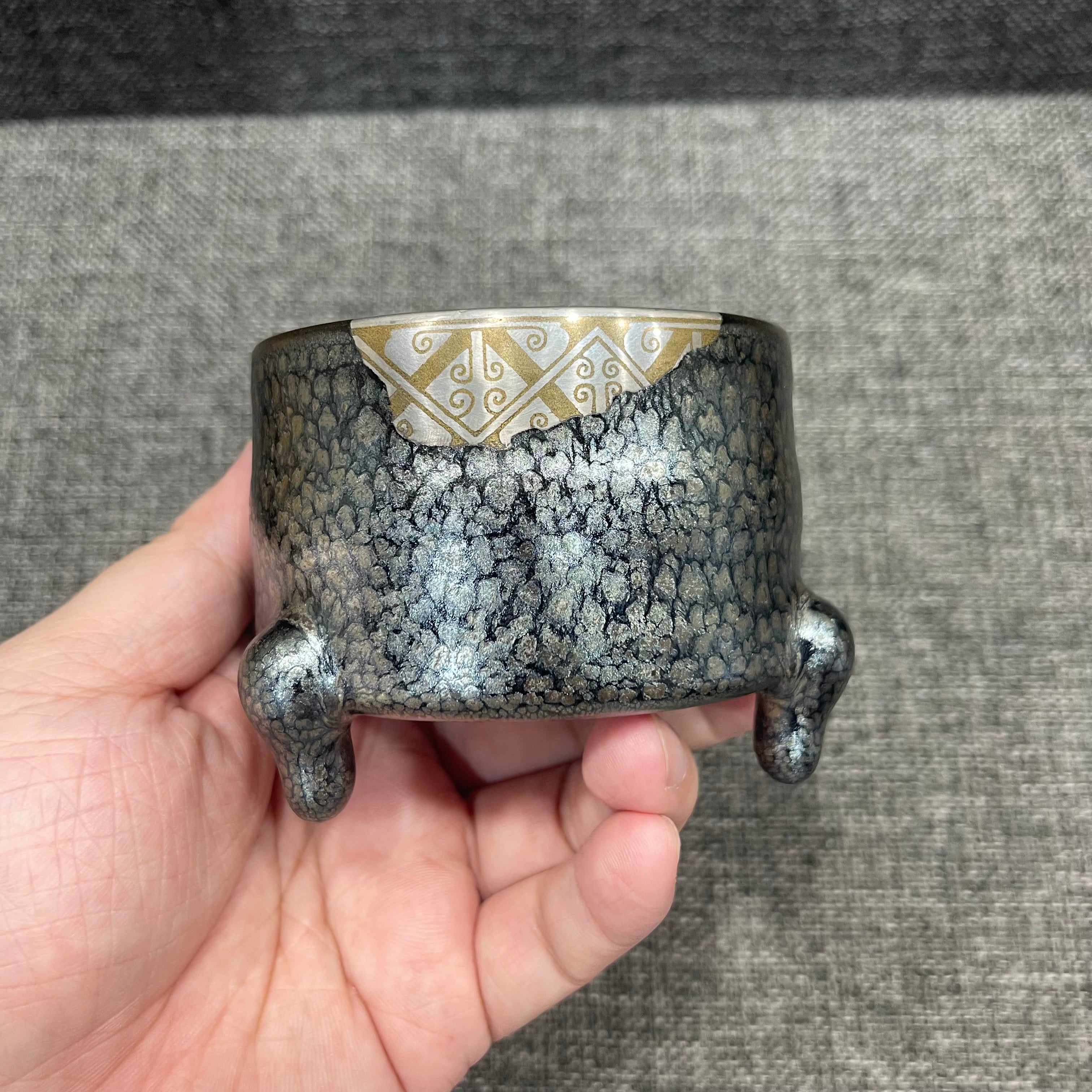 Imitating the gold and silver inlaying technique from the Warring States period, Jianzhan oil-drop three-legged incense burner
