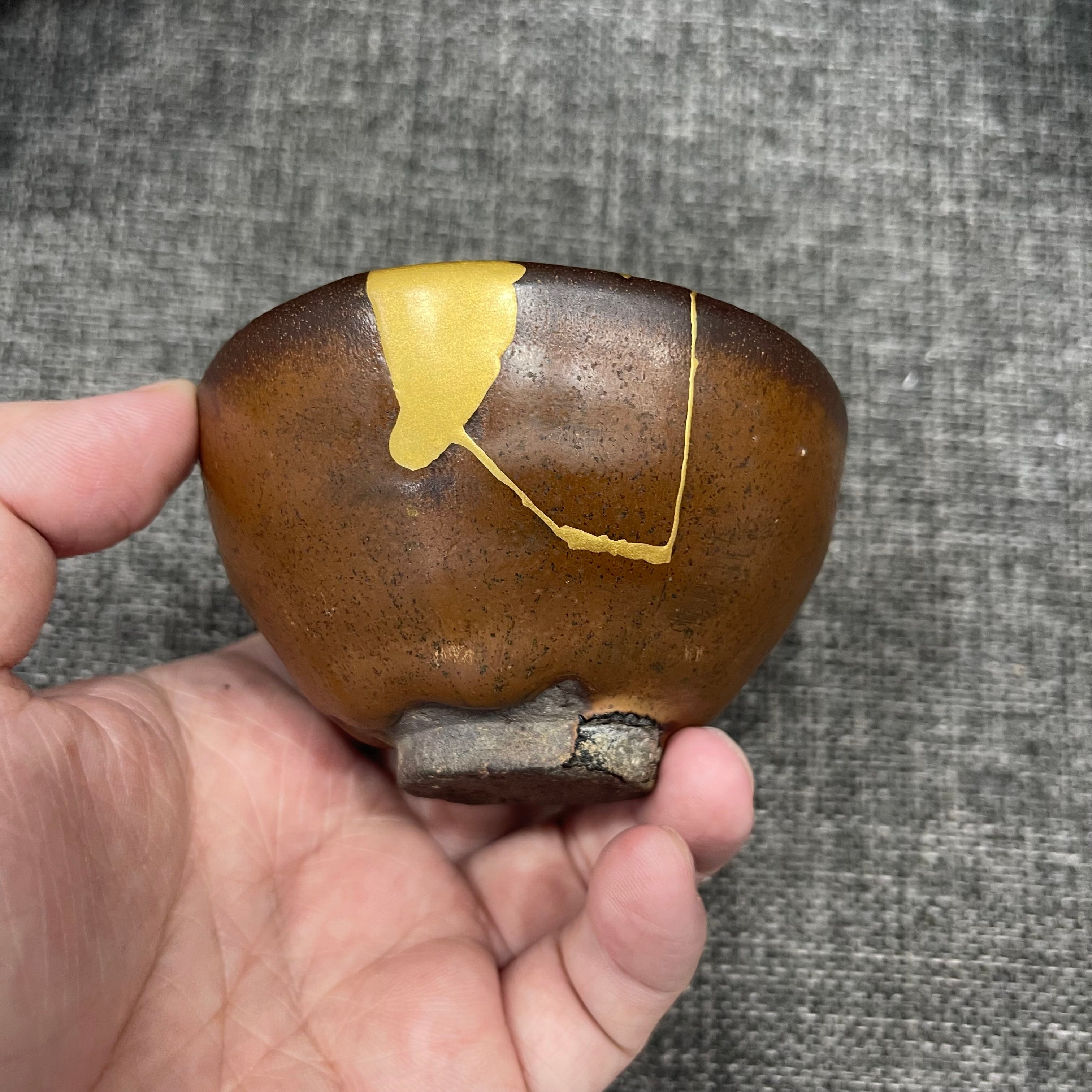 Song Dynasty persimmon-red glaze bell-shaped cup, restored with gold repair technique, Jianzhan tea cup