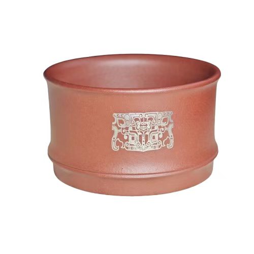 A purple clay jade inlaid with gold and silver engraving tea cup featuring the bronze human face pattern from Sanxingdui culture