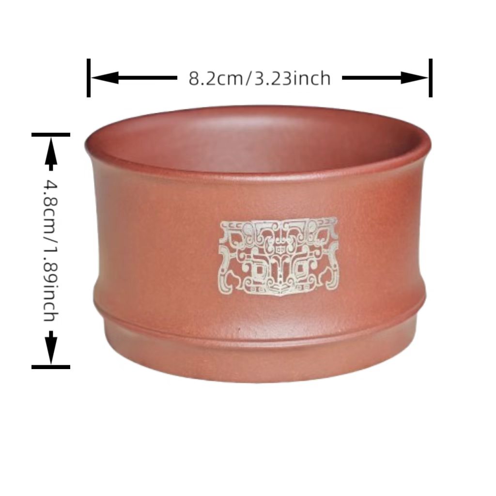 A purple clay jade inlaid with gold and silver engraving tea cup featuring the bronze human face pattern from Sanxingdui culture