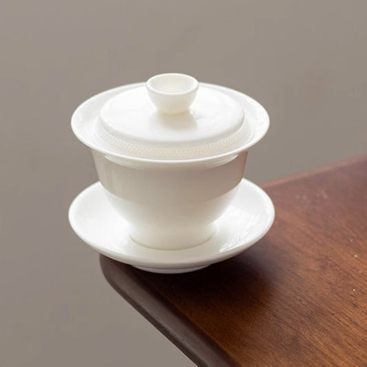 Pure white anti-scalding three-talent cover bowl, simple ceramic integrated thousand-hole filter tea brewer, kung fu tea set, white porcelain cover bowl