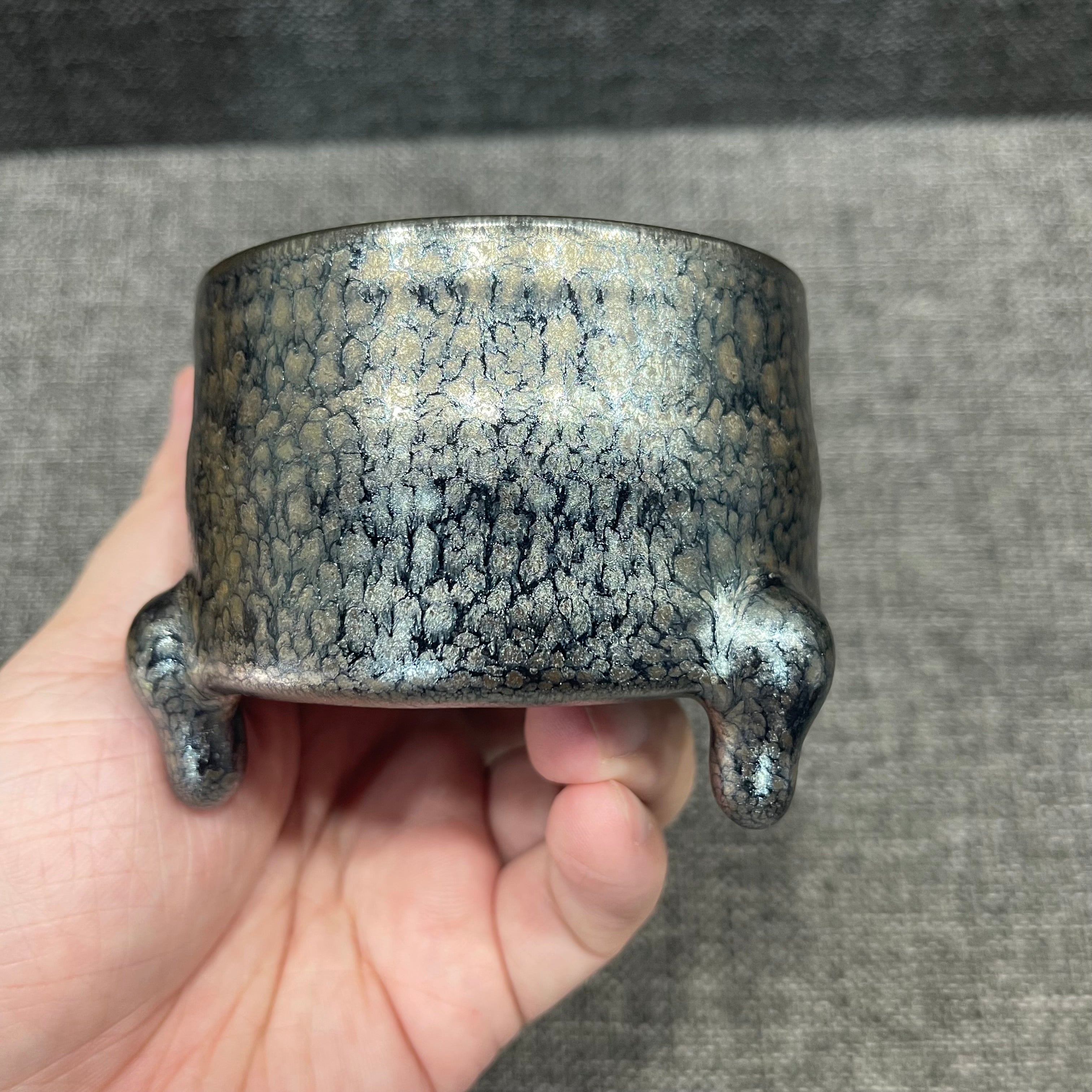 Imitating the gold and silver inlaying technique from the Warring States period, Jianzhan oil-drop three-legged incense burner