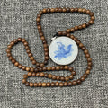 Blue and white porcelain fragment, pendantTeak wood necklace