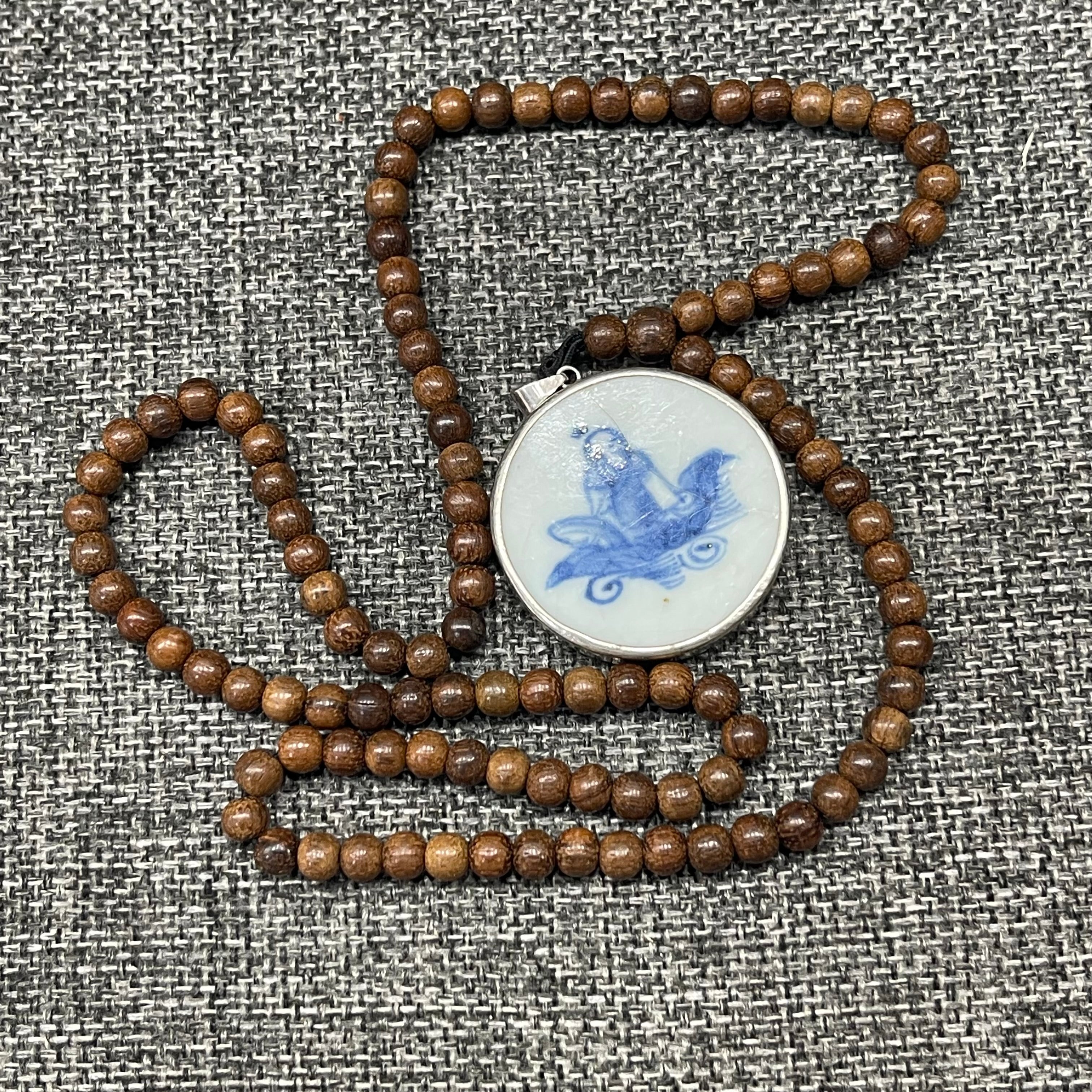 Blue and white porcelain fragment, pendantTeak wood necklace