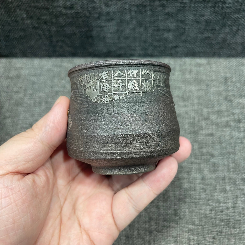 Jianzhan is naturally fired with ash, using a wood-fired kiln. Hand-carved tin sculptures of Buddha statues from Dunhuang