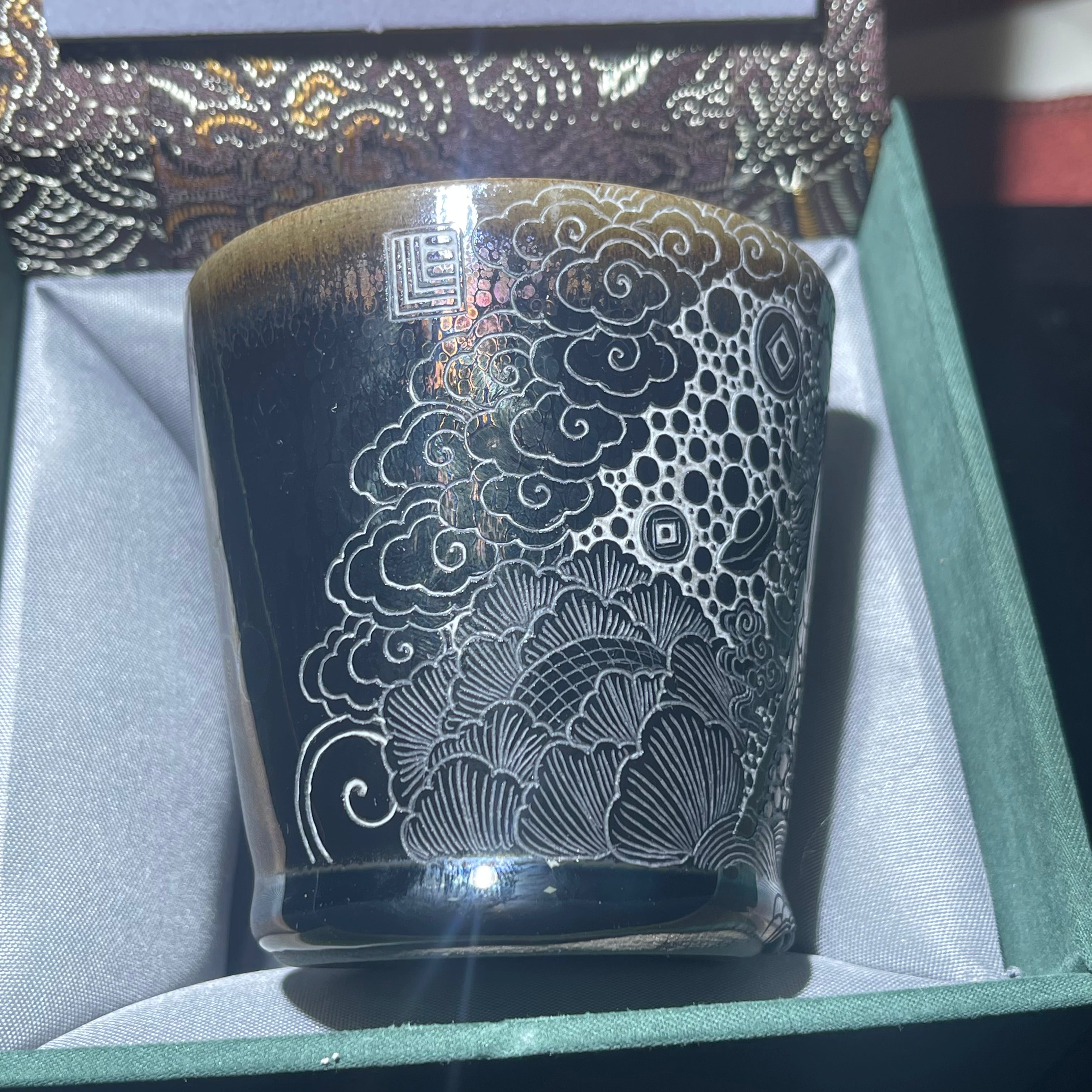 Jianzhan Coke cup with a galloping horse and a pattern of wealth coming from all directions.