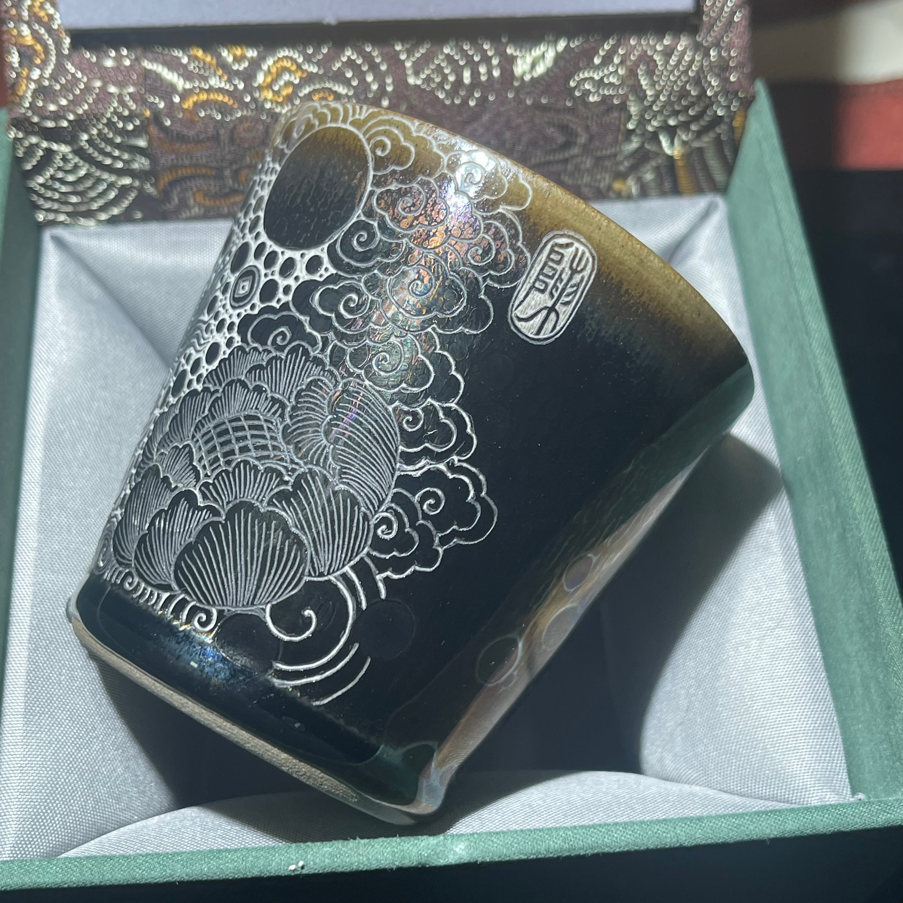 Jianzhan Coke cup with a galloping horse and a pattern of wealth coming from all directions.