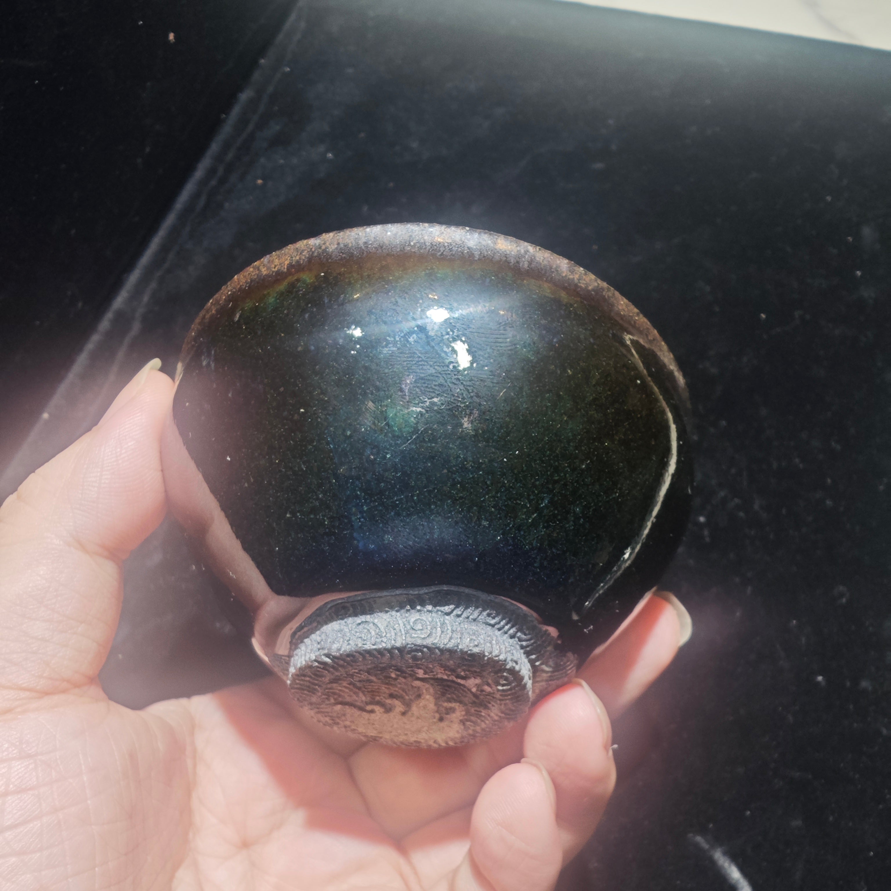 Ink jade ash-burned Jianzhan teacup, hand-carved with wave patterns