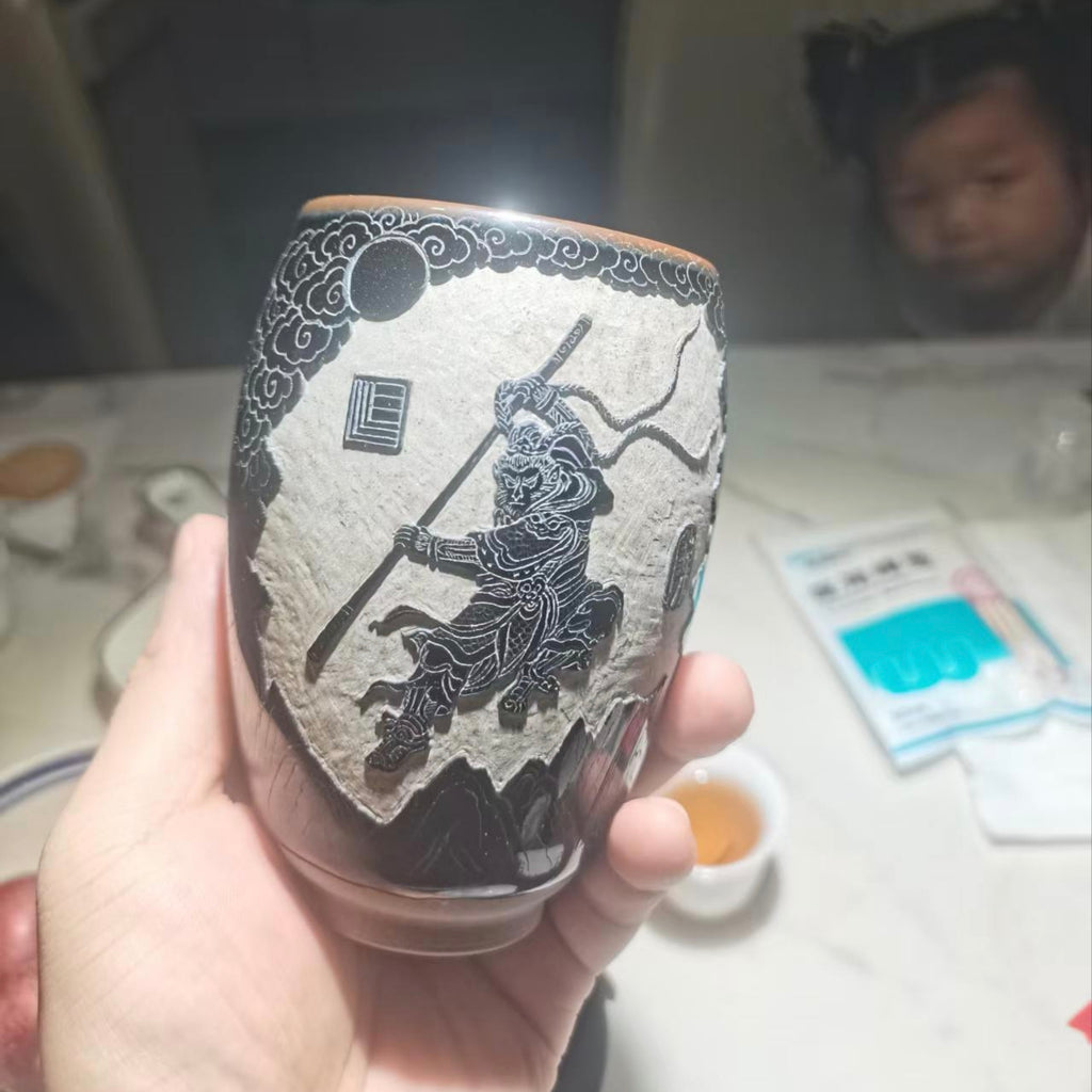 Monkey King the Monkey King, black glazed carved teacup.