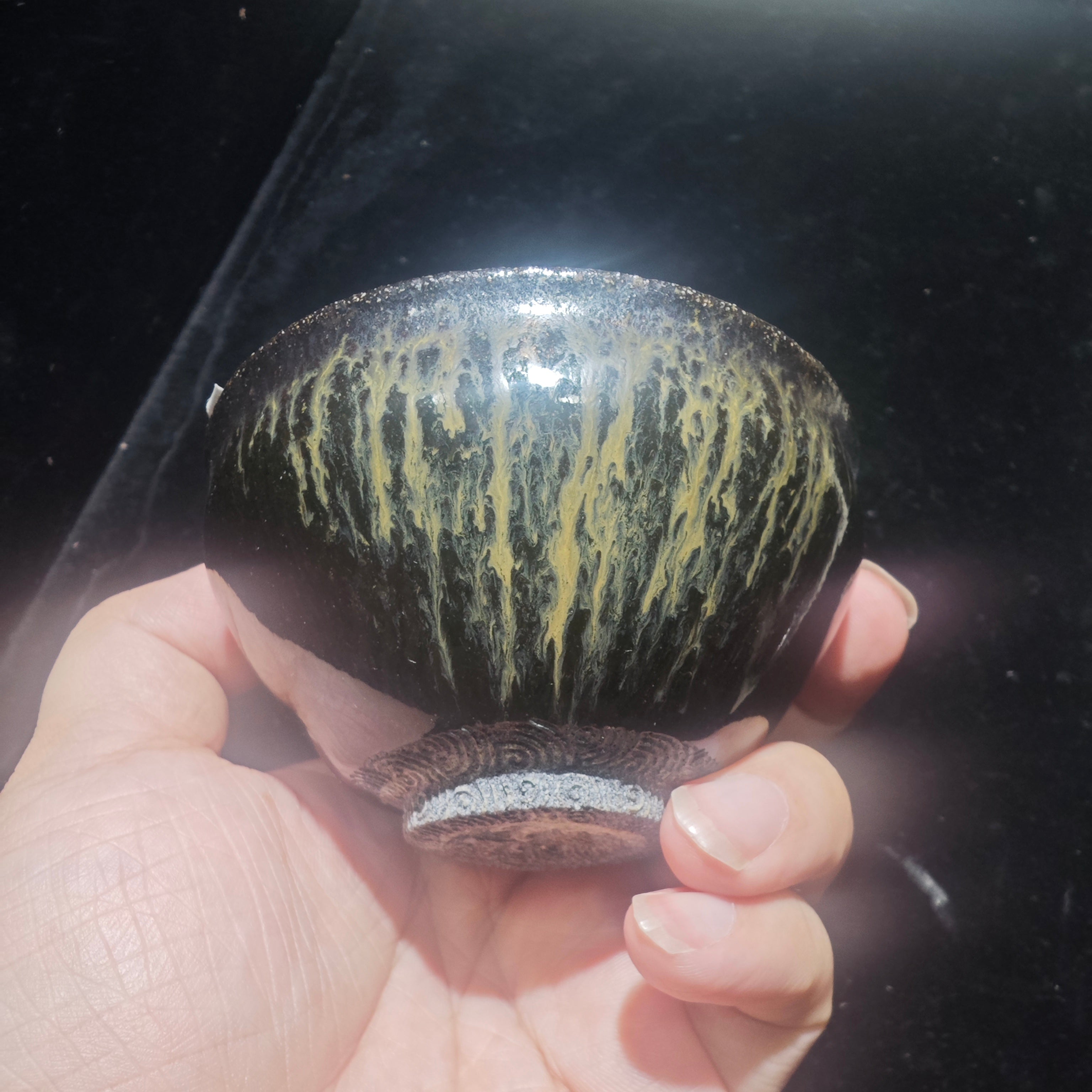 Ink jade ash-burned Jianzhan teacup, hand-carved with wave patterns