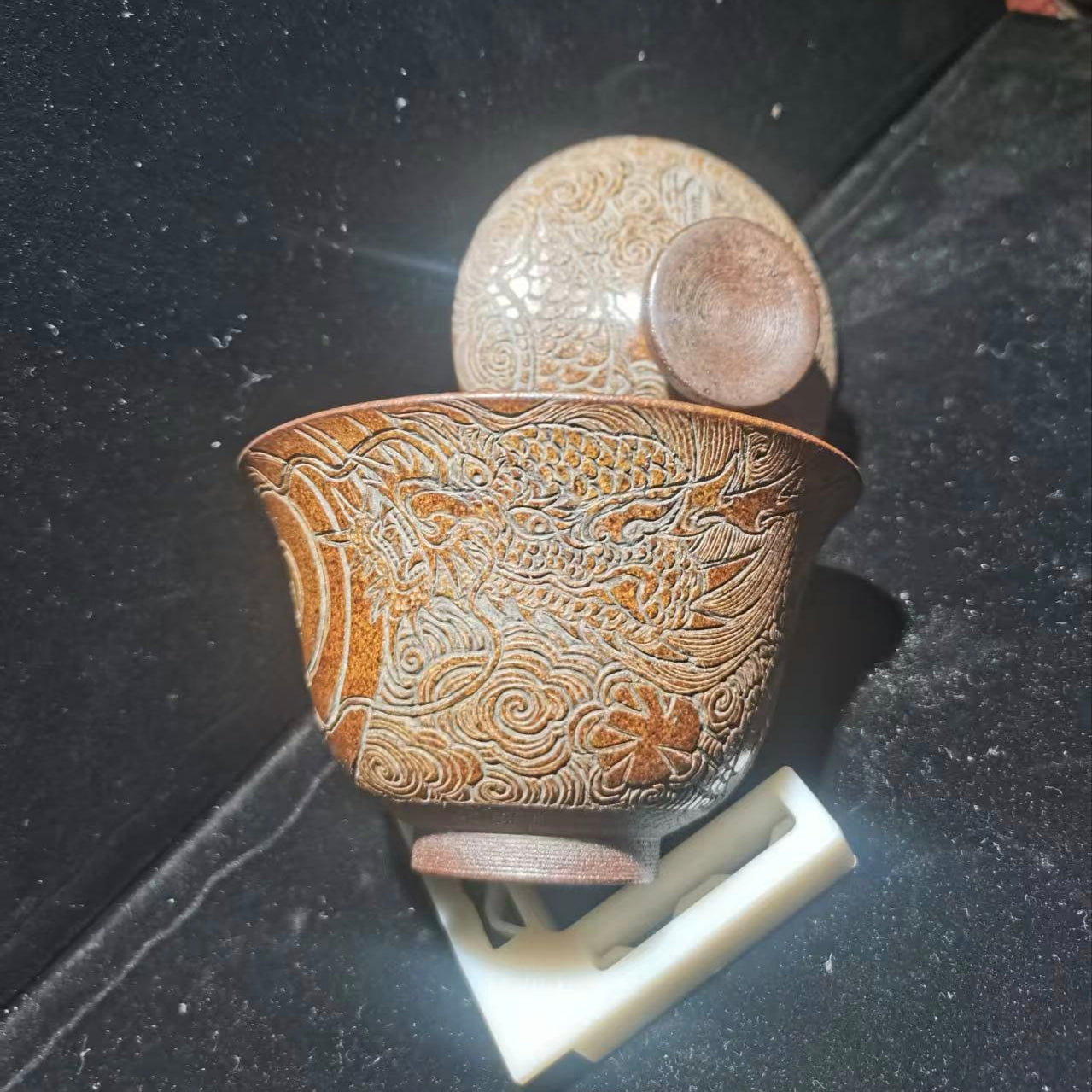 Only when fully staffed can we make the bowls, with dragon patterns carved on them