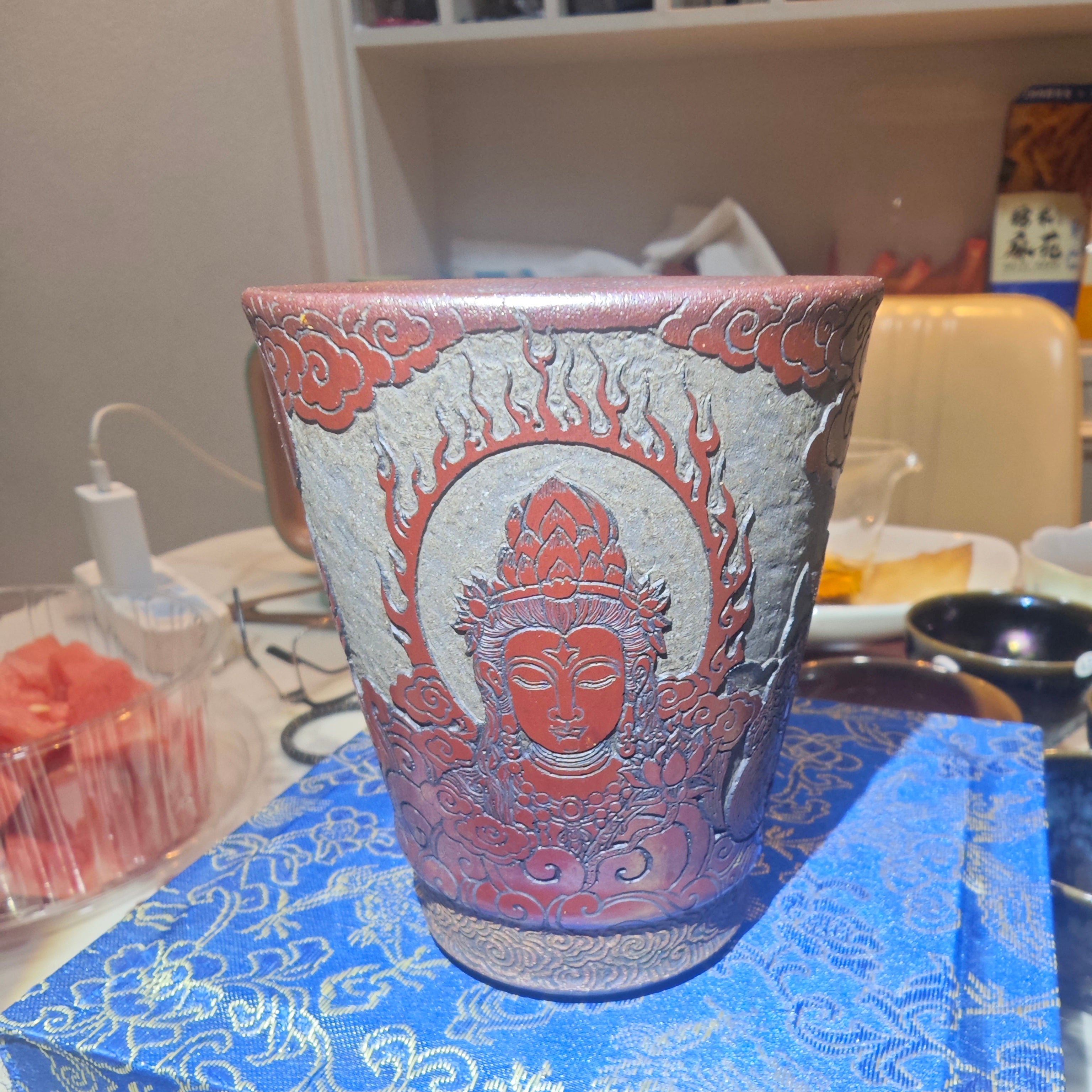 Guanyin statue, Jianzhan tea cup carvingDragon kiln fired over wood, cow blood red, Coke bottle shape