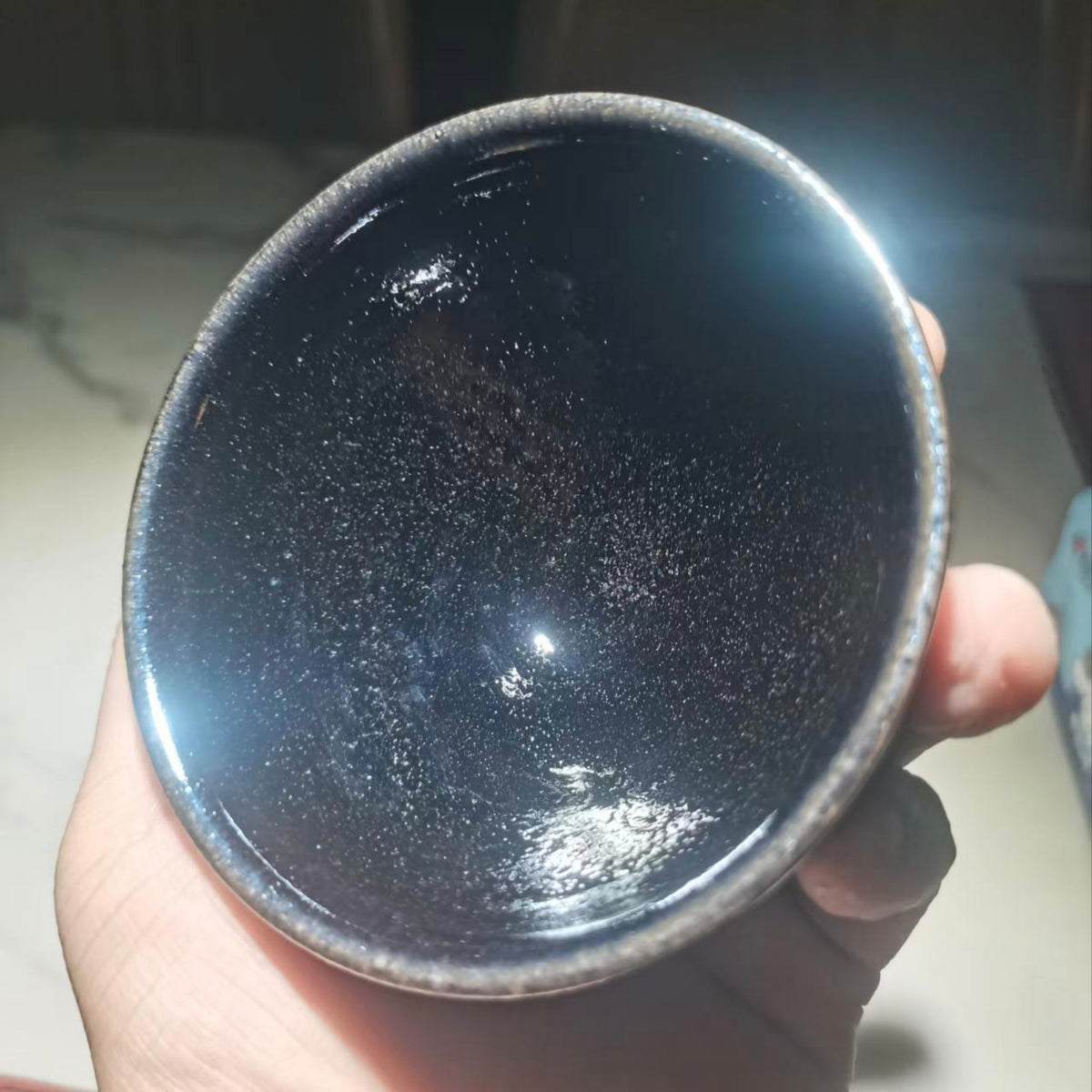 Tiger Descending the Mountain, hand-carved black-glazed teacup