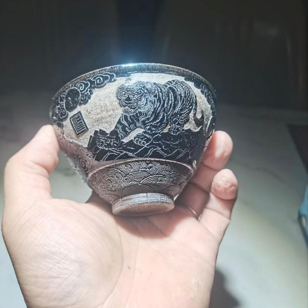 Tiger Descending the Mountain, hand-carved black-glazed teacup