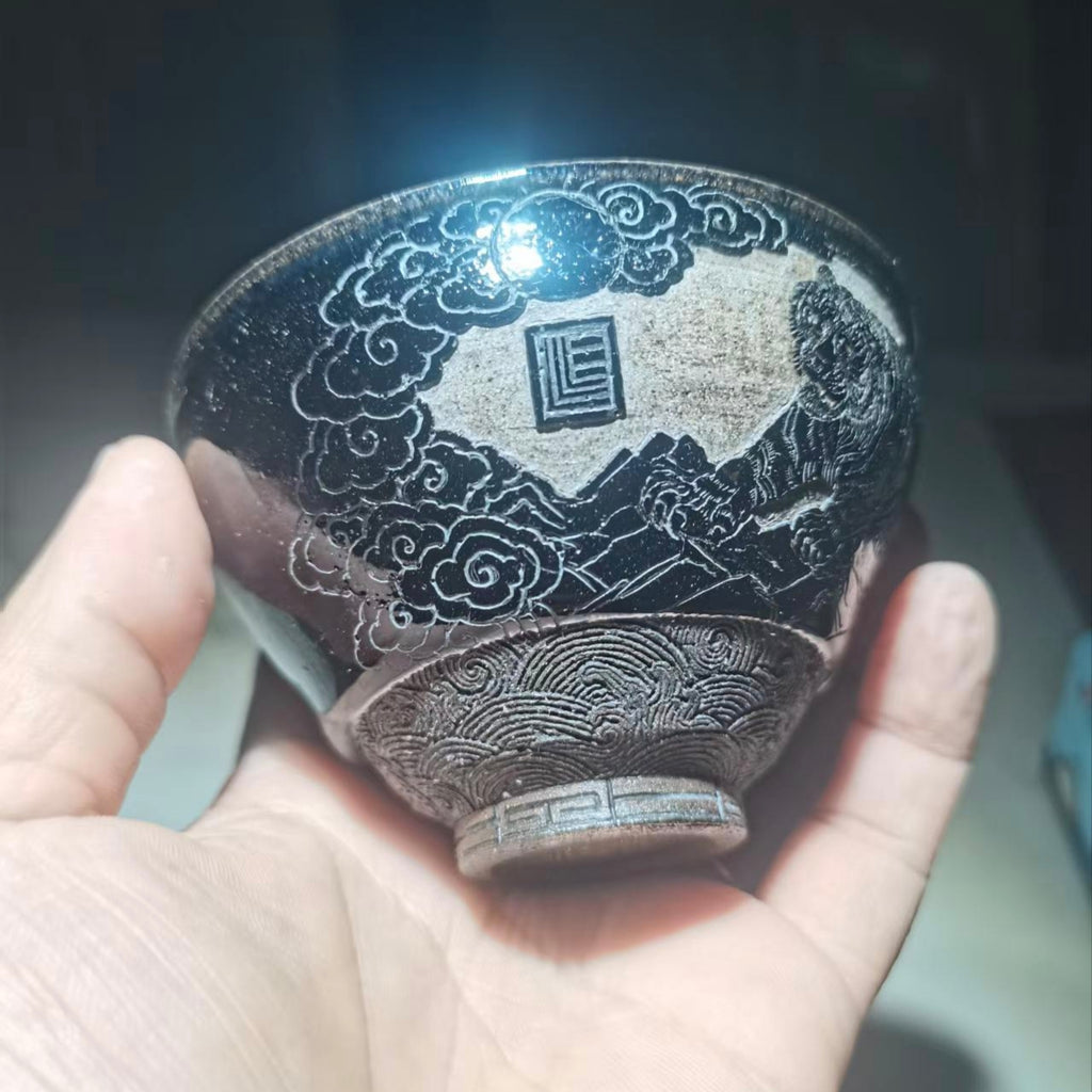 Tiger Descending the Mountain, hand-carved black-glazed teacup