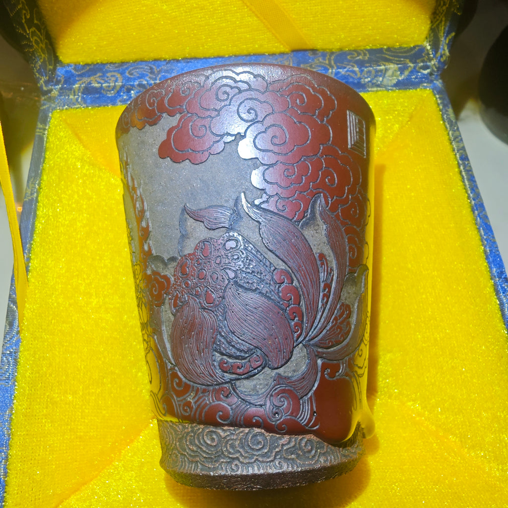 Guanyin statue, Jianzhan tea cup carvingDragon kiln fired over wood, cow blood red, Coke bottle shape