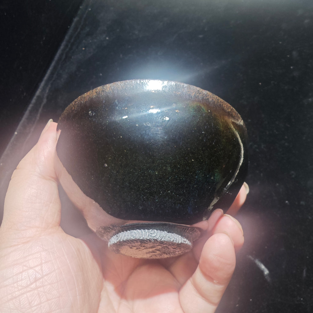Ink jade ash-burned Jianzhan teacup, hand-carved with wave patterns