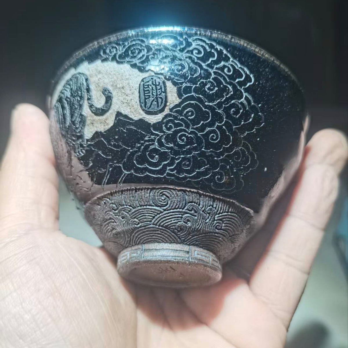 Tiger Descending the Mountain, hand-carved black-glazed teacup