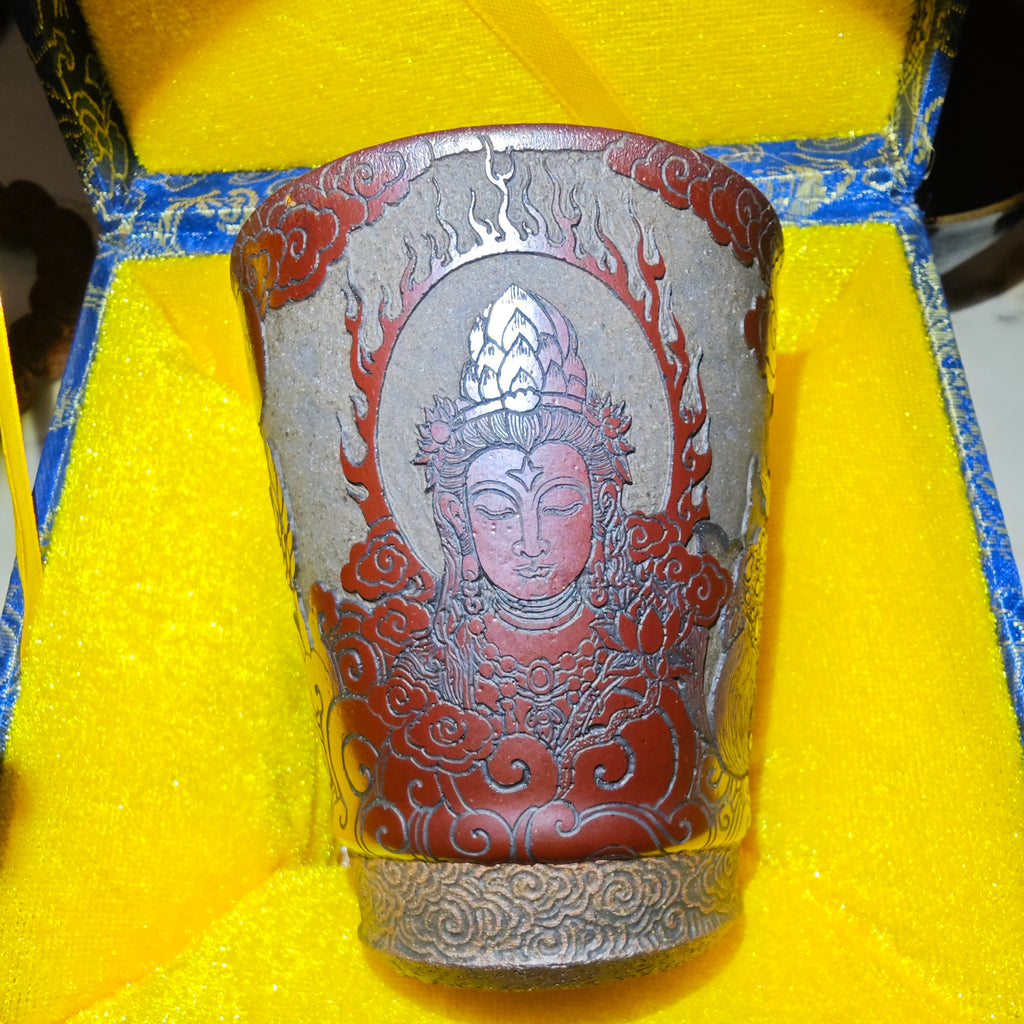 Guanyin statue, Jianzhan tea cup carvingDragon kiln fired over wood, cow blood red, Coke bottle shape