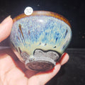Ash-burned Jianzhan tea cup with animal claw foot and dragon carving, handmade craft