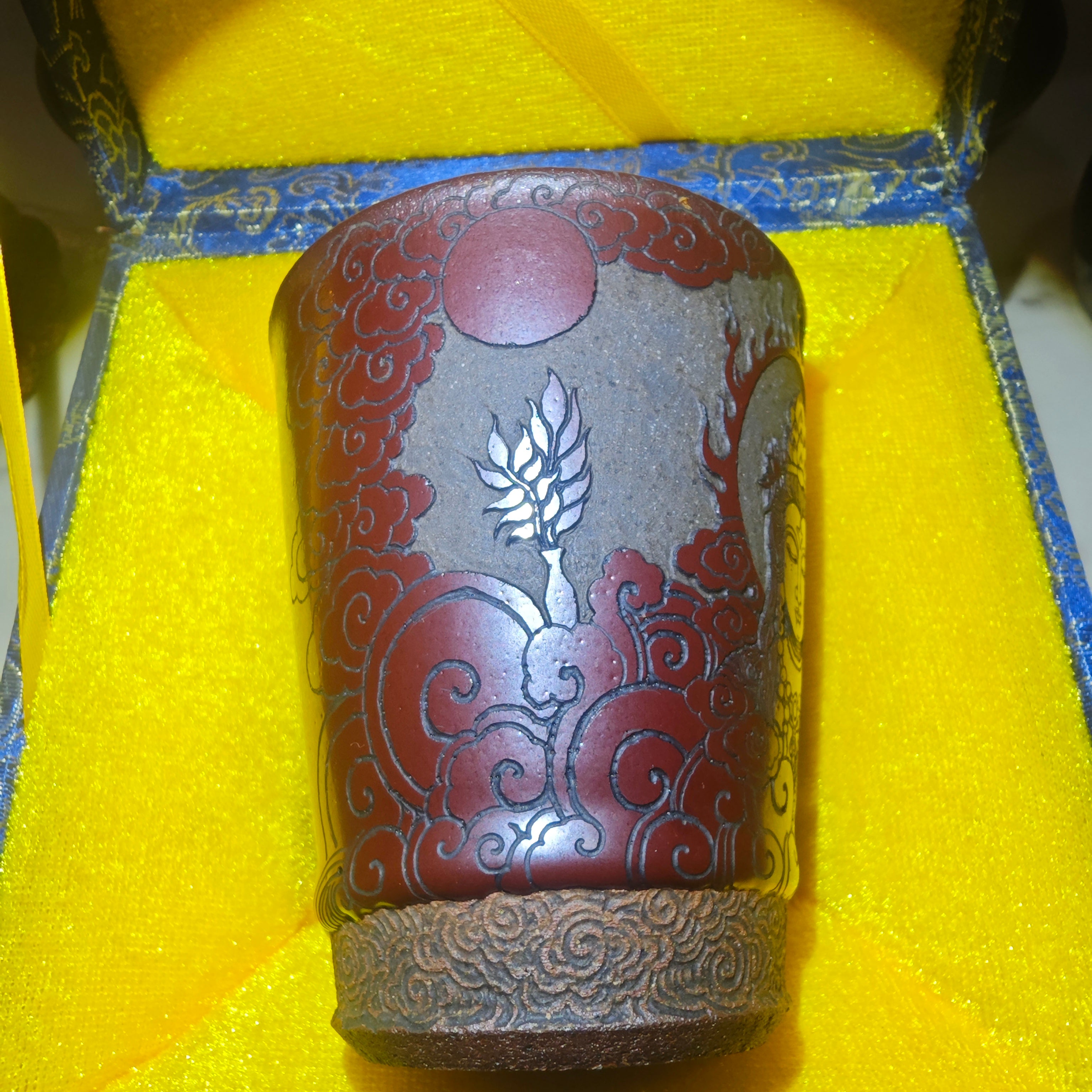 Guanyin statue, Jianzhan tea cup carvingDragon kiln fired over wood, cow blood red, Coke bottle shape