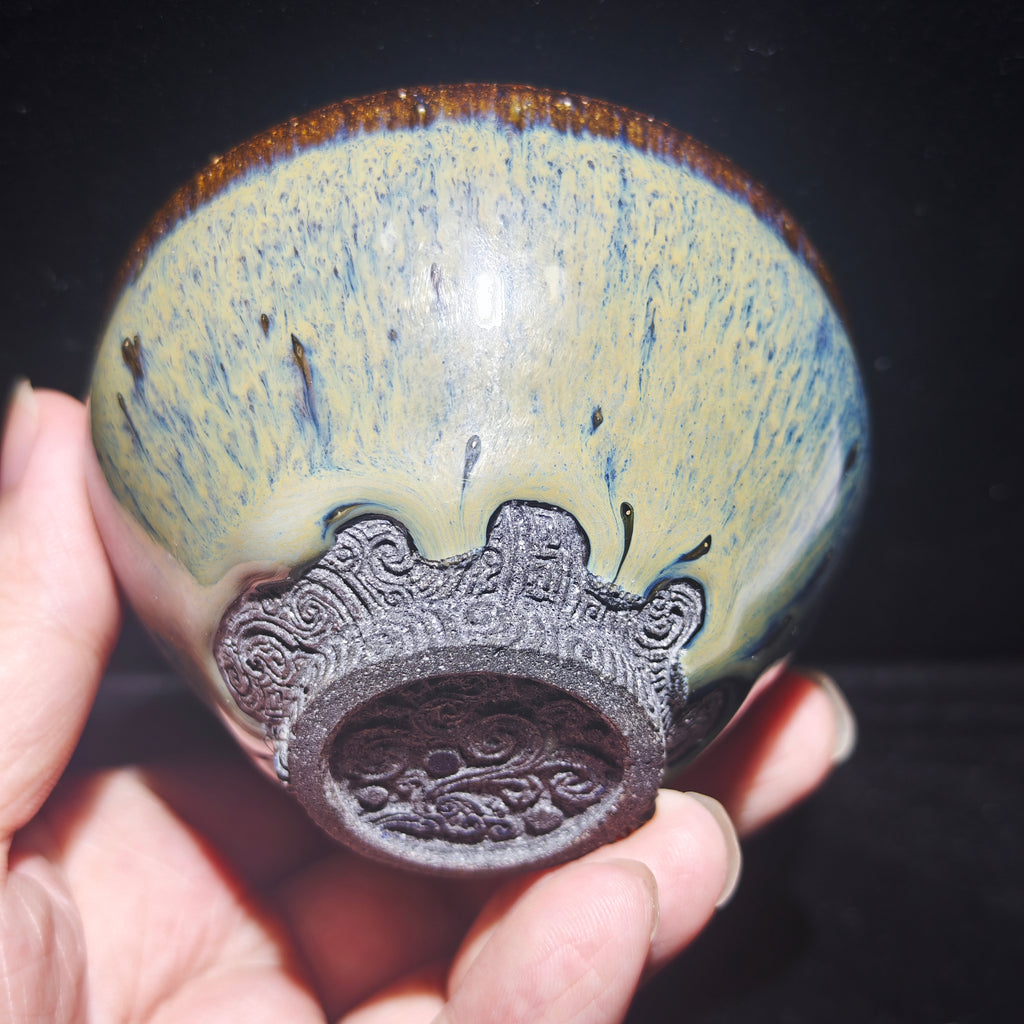 Ash-burned Jianzhan tea cup with animal claw foot and dragon carving, handmade craft