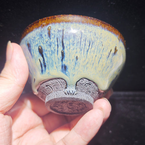 Ash-burned Jianzhan tea cup with animal claw foot and dragon carving, handmade craft