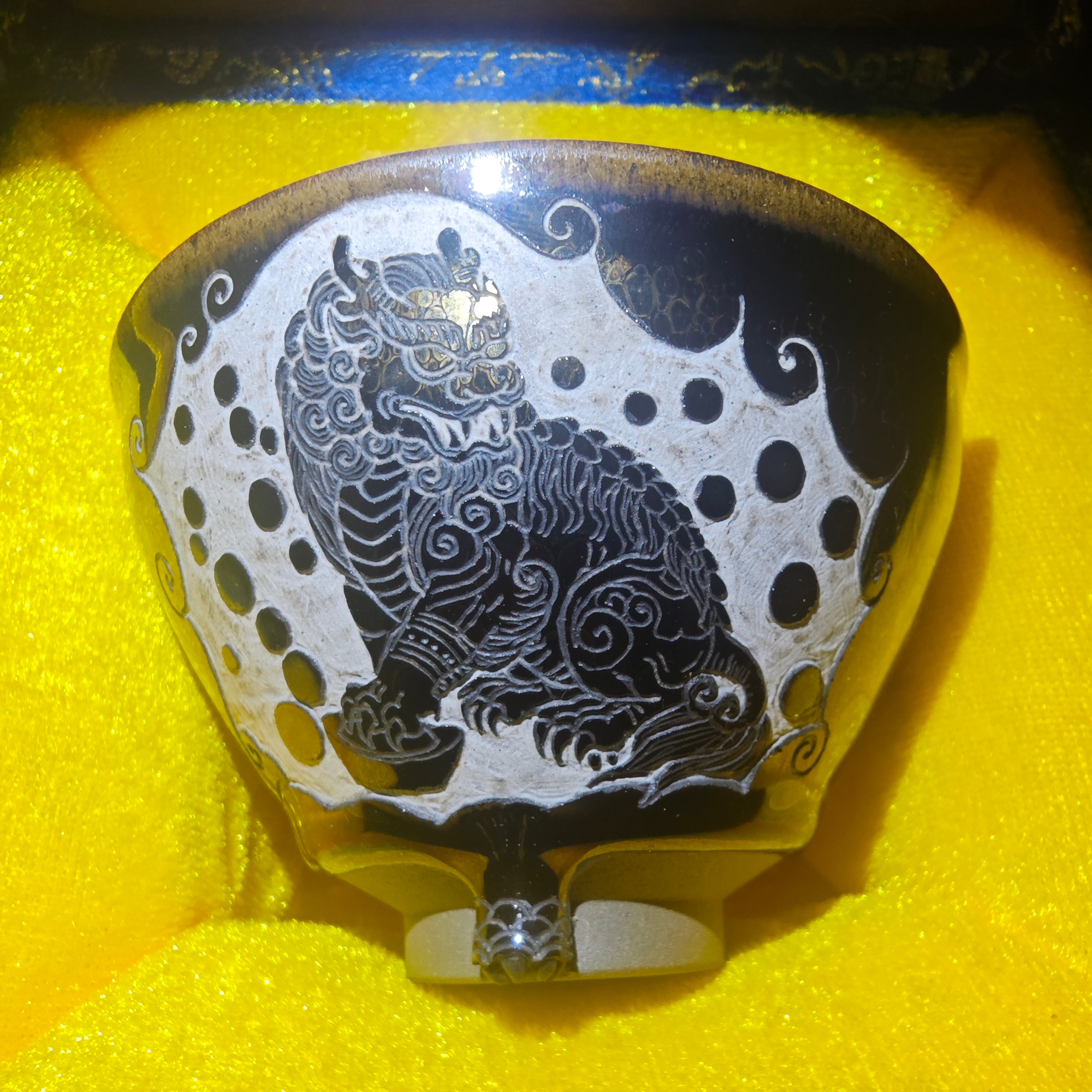 Pi Xiu pattern, symbolizing good luck, with a carved design on the Jian Zhan tea cup
