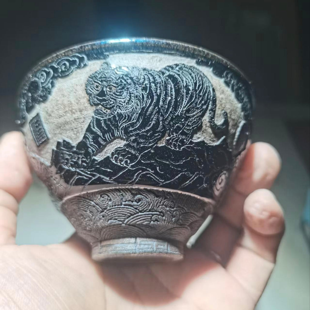 Tiger Descending the Mountain, hand-carved black-glazed teacup
