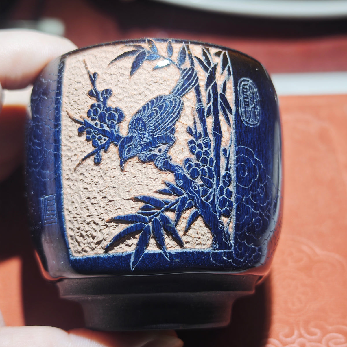 A magpie perched on a branch - a beautiful symbol. Jianzhan tea cup carving